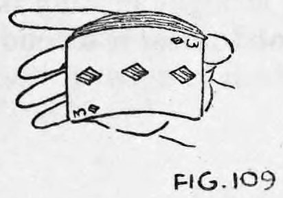 Fig. 109. — The right hand holds the curved pack at about a 45-degree angle, the faces of the cards turned toward the audience.