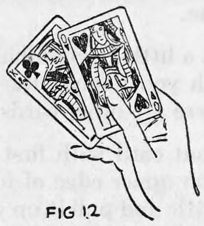 Fig. 12. — The right hand fans the King and Queen of clubs, held with the thumb over the staple and rubber band, to show them to the audience.