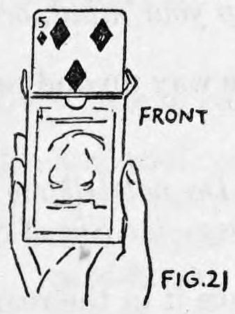 Fig. 21. — The case seen from the front as the right forefinger pushes the first selected card, the five of diamonds, up out of the top of the case.