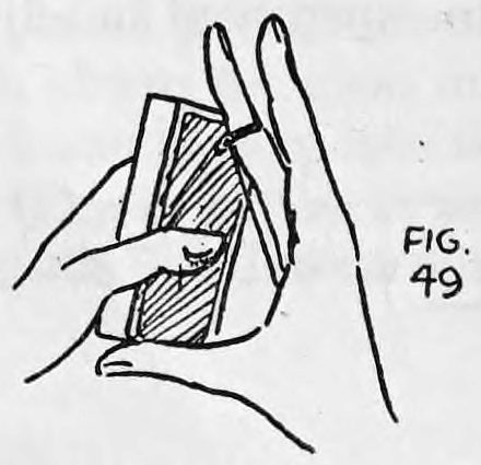 Fig. 49. — The right hand holds the deck of cards upright with fingers above and thumb below, while the left hand comes up to meet it.
