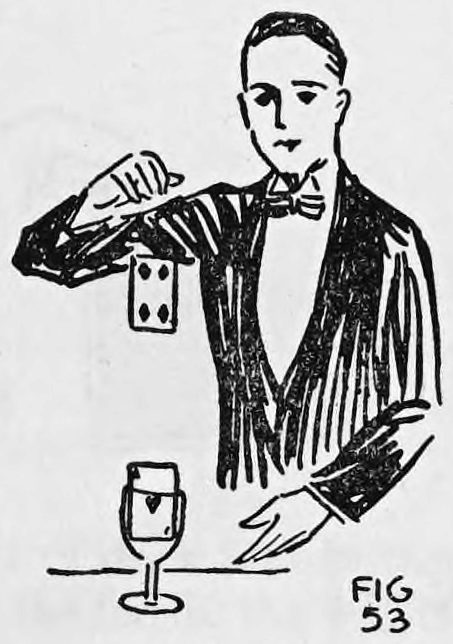 Fig. 53. — A performer in evening dress holds his right hand high, a card risen from the glass on the table hanging below his fingertips.