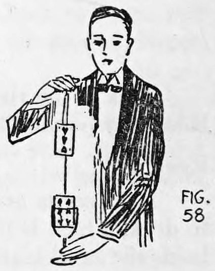Fig. 58. — Thurston in evening dress, seen from the audience, with a card rising from the goblet to his raised right hand while his left hand holds the glass below.