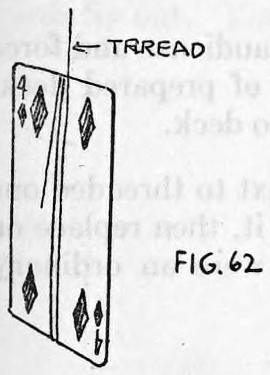 Fig. 62. — A playing card with the end of the thread wrapped around it, the thread running up past the top of the card. The label marks the thread.