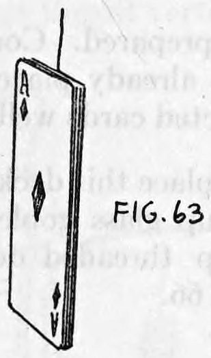 Fig. 63. — A card seen edge-on with the thread rising from its top, the three forcing cards placed in front of the wrapped starting card.