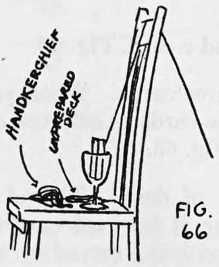 Fig. 66. — A chair with a goblet holding the threaded deck on its seat, beside the handkerchief and the unprepared deck; the thread runs up over the chair back. Labels name the handkerchief and unprepared deck.