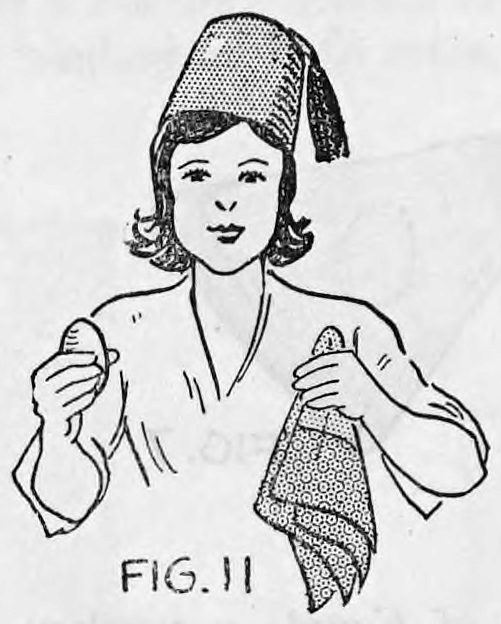 Fig. 11. — The girl wearing the fez, holding the egg in one hand and the folded handkerchief by its centre in the other.