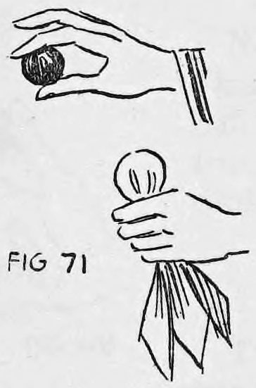 Fig. 71. — The right hand shows the red ball above, while the left hand grasps the ball wrapped in the silk below.