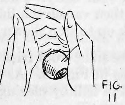 Fig. 11. — The left hand held up against the right with fingers close together and curled inward, the ball hanging between them.