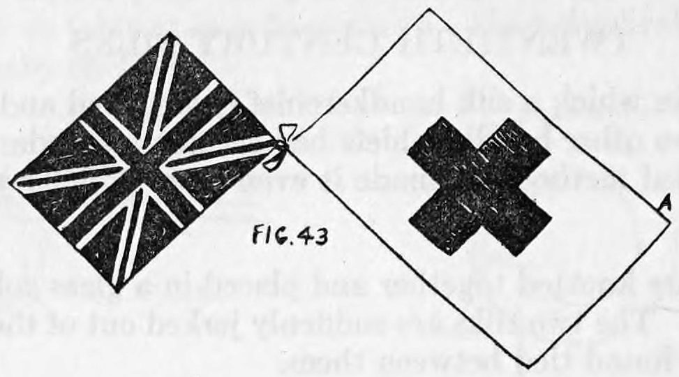Fig. 43. — A Union Jack and a Red Cross flag, both set corner-up as diamonds, tied together at a corner by the small tab of silk, with corner A marked at the Red Cross flag.