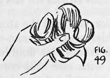 Fig. 49. — The hands roll the Irish flag around the folded Union Jack into a bundle.