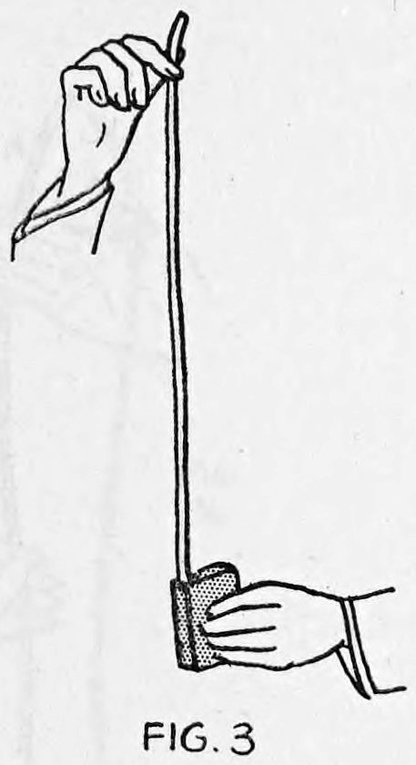 Fig. 3. — The right hand holds the empty package low while the left hand raises the rope to full length, hanging straight up out of the package.