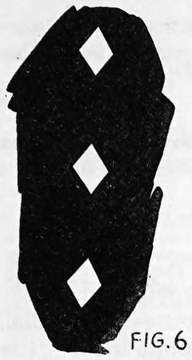 Fig. 6. — A tall dark silhouette of a ghostly figure with three glowing diamond pips one above the other, the ghost card four or five feet high.