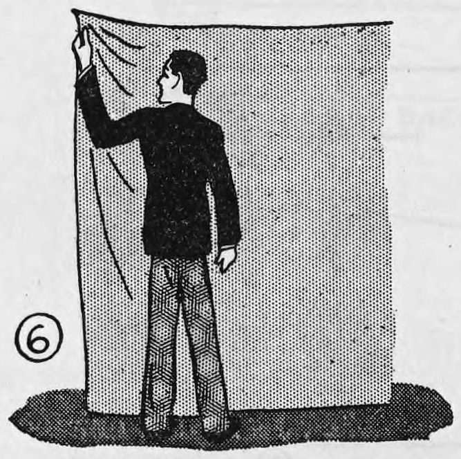 Fig. 6. — Rear view: the assistant stands behind the hung blanket with his back to us, only his left hand showing at the upper corner.