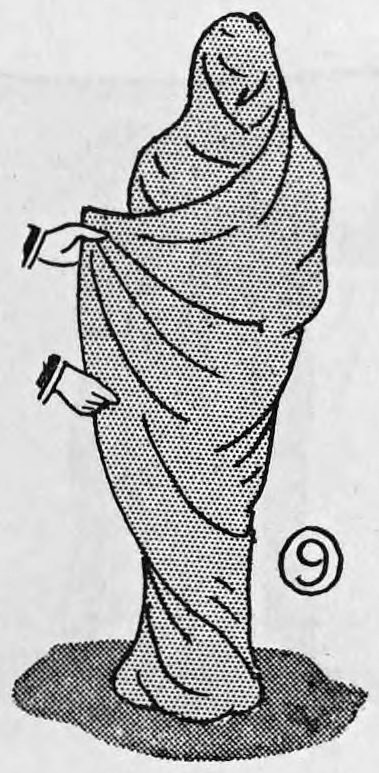 Fig. 9. — The assistant completely wrapped in the blanket like a mummy, one hand holding the edge of the cloth out at his side.