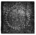 The second division: the same luminous circle, but with far finer and more numerous teeth crowded round its rim.