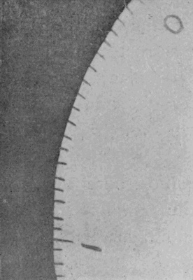 Photograph of the edge of a rapidly whirling disc. — The pen-and-ink marks round the rim of the cardboard disc, turning fifty-three times a second, stand out sharp and unblurred against the dark background.