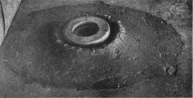 Permanent Splashes left where a Projectile has entered an Armour-plate. (See Chapter 10.) — Here the steel has risen into a thick, smooth-lipped collar round the hole, standing on a broad raised mound whose outer edge is cracked and flaked away.