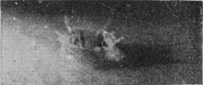 3 0·002 sec. — A dim, blurred picture of the crater already thrown up round the sinking drop, with ragged jets starting from its rim.
