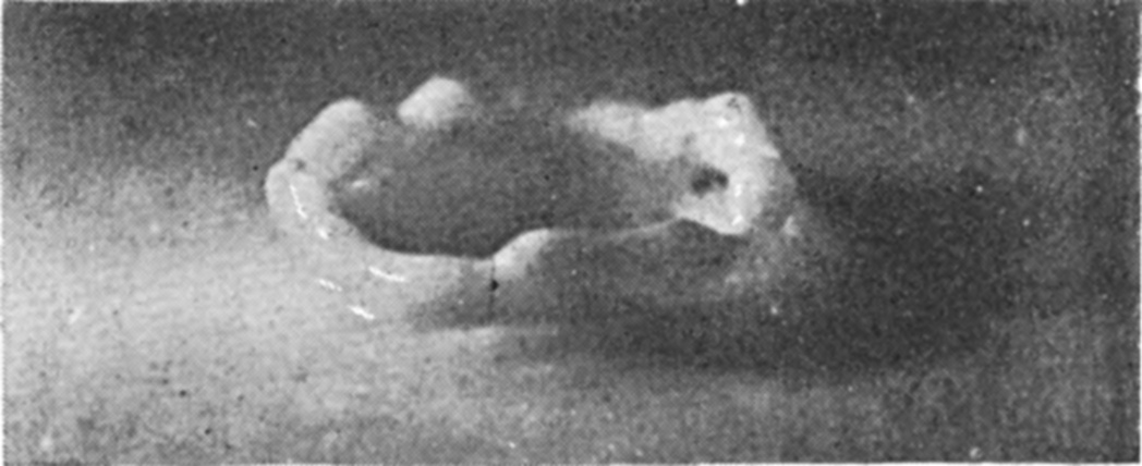 8 0·050 sec. — The crater has sunk to a low ring of rounded lobes lying on the surface round a shallow hollow.