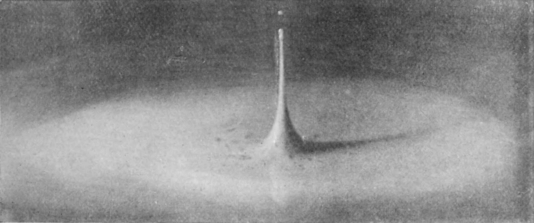 22 a 0·248 sec. — The secondary jet at its tallest, a long, thin spire flaring at its base, with a tiny drop breaking away from its tip.