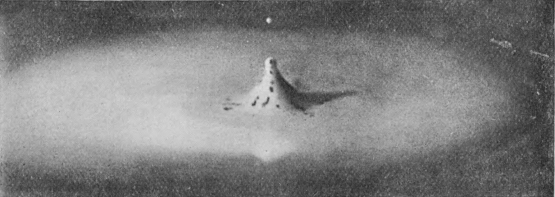 23 a 0·253 sec. — The secondary column subsiding into a low cone spotted with lamp-black, not yet spread out into a second cake.