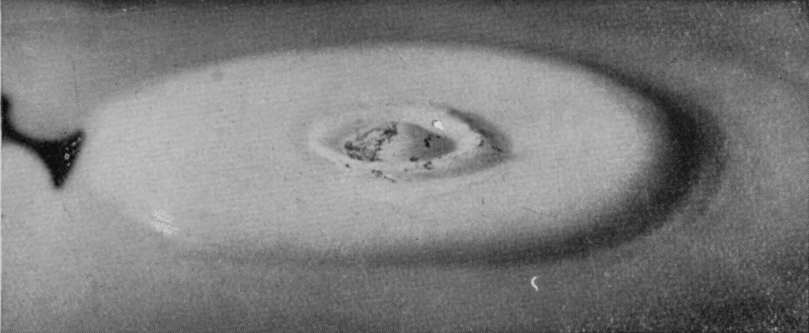 19 b 0·237 sec. — The impact of that drop has opened a small secondary crater on top of the first cake, its floor streaked with lamp-black.