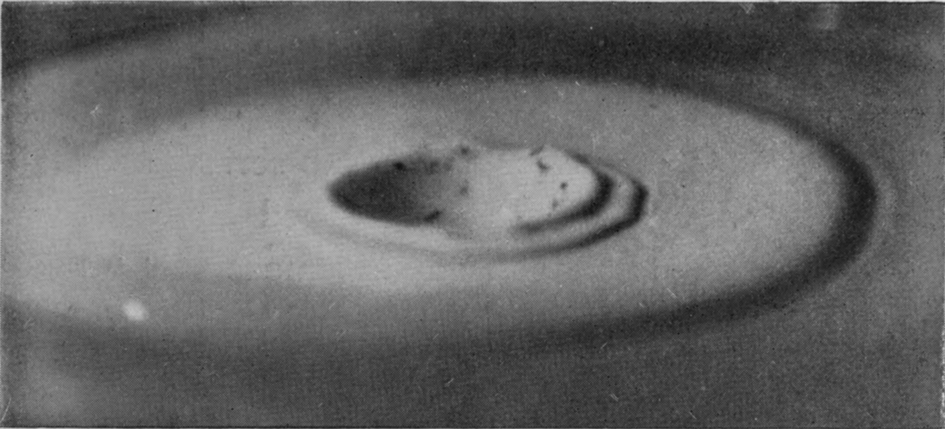 22 b 0·261 sec. — The secondary crater lower and wider, its advancing edge breaking up into two or three smaller ripples.