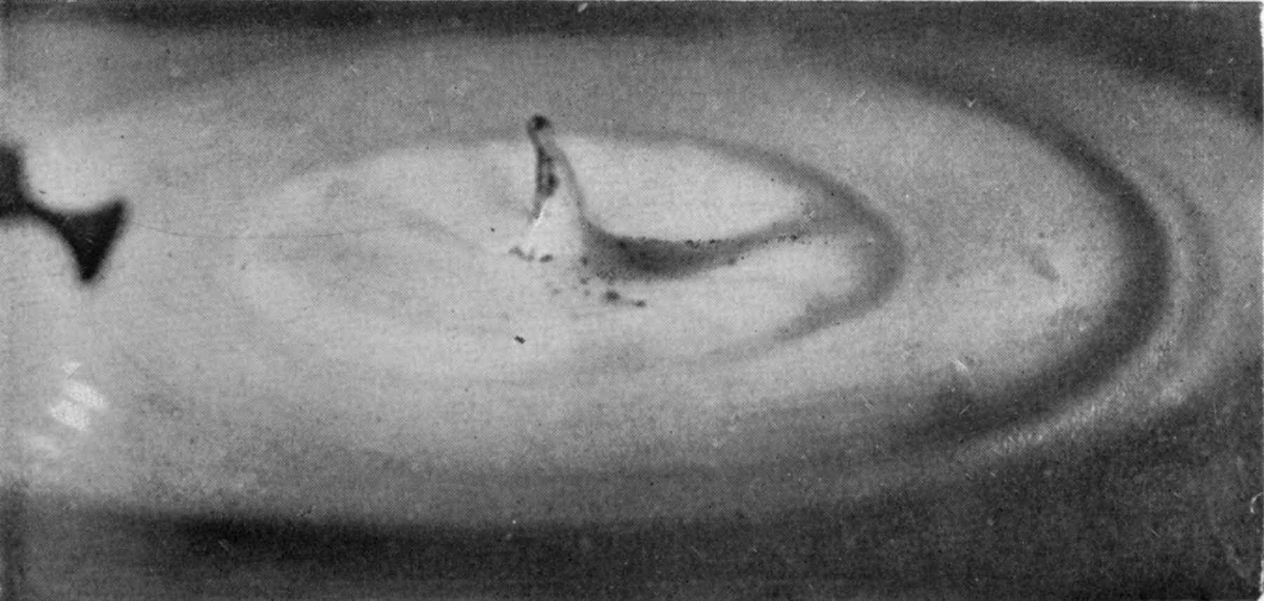 24 b 0·311 sec. — A small secondary column, dark at its tip, stands up from the centre of the cake inside two circular ripples, with its shadow falling to the right.