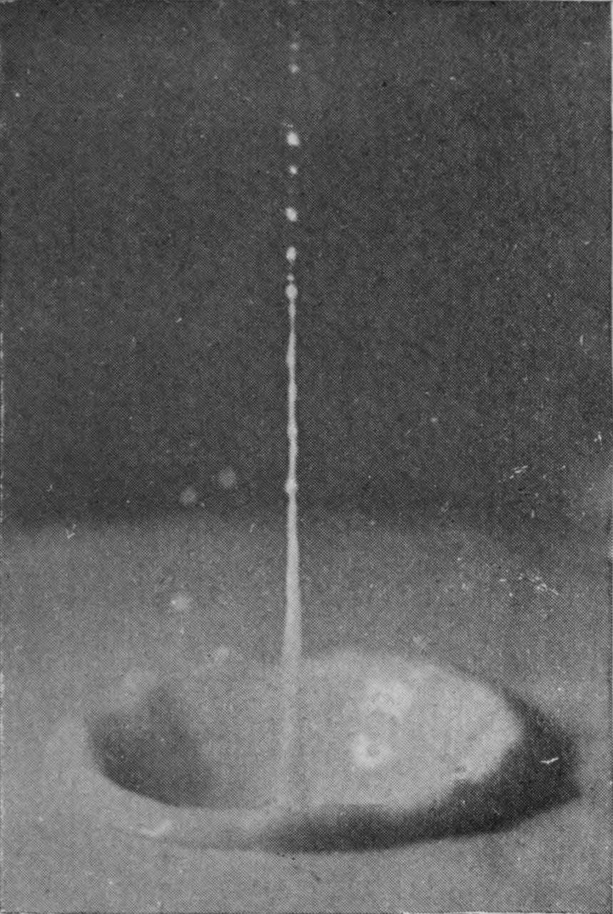 11 0·068 sec. — A slender jet rises from the depths of the crater and is already splitting into a line of little drops at its upper end.