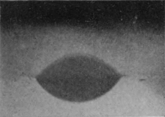 1 T = 0 — Seen through the side of the vessel, the sphere is just entering; the part below the faint surface line is matched above it by its reflected image.