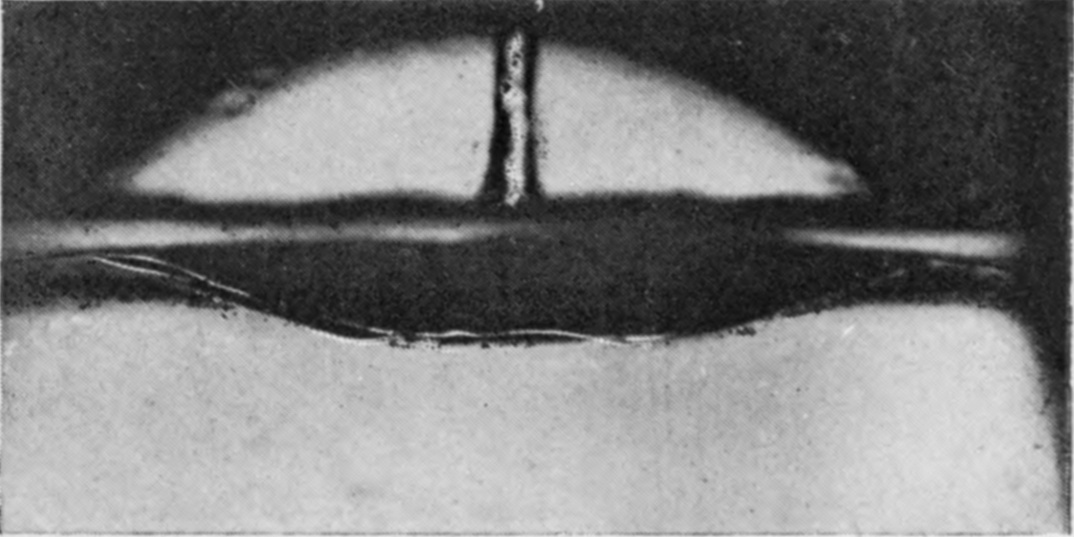 13 0·070 sec. — The jet has become a straight, well-established column rising from the middle of a shallow lens-shaped hollow.