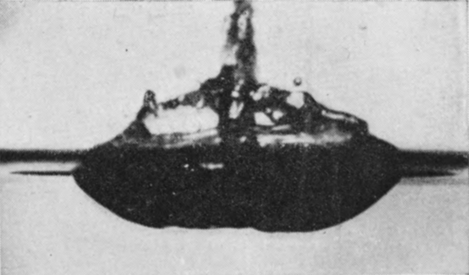5 0·082 sec. — The jet has stabbed through the top of the bubble, whose wall is collapsing in dark shreds around it, above a flattened cavity.