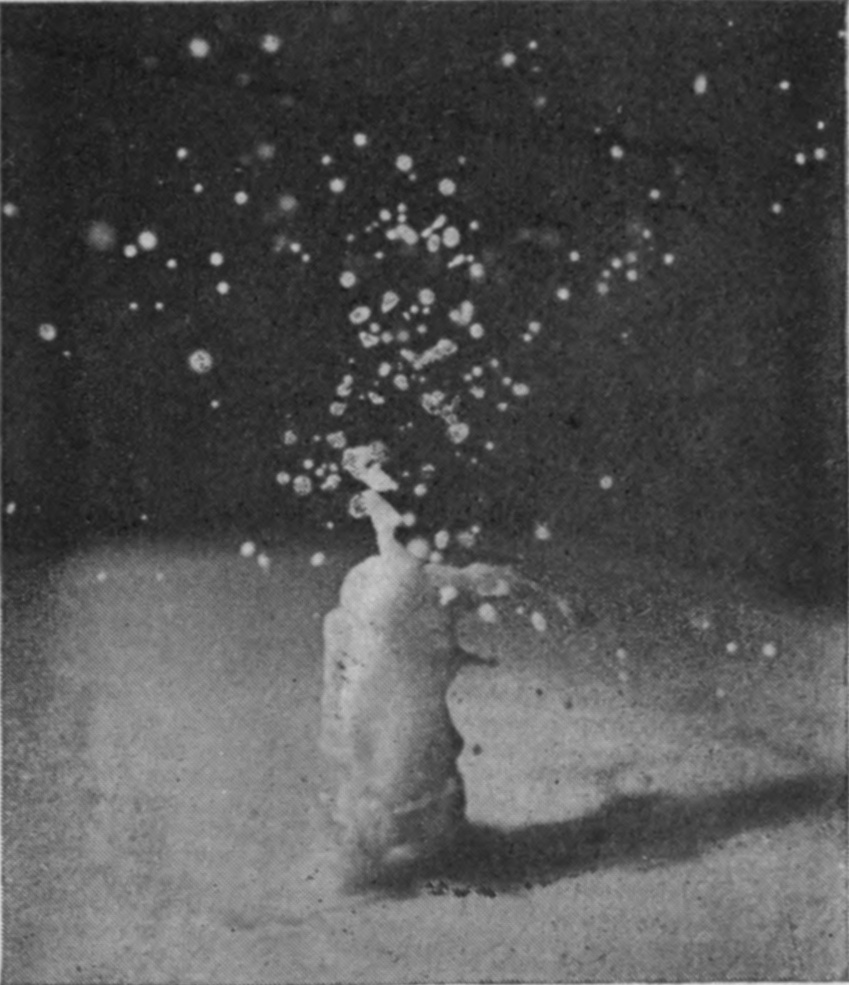 4 0·024 sec. — All that remains is a small, bottle-shaped column with a thin spout at its top, among scattered falling drops.