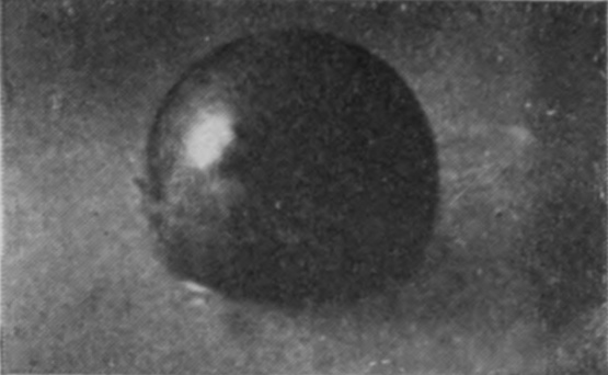 3 — The sphere has gone further in, and the sheath of liquid is creeping up over its upper surface.