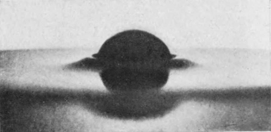 1 T = 0 — A rough sphere enters the pure glycerine, raising only a low, smooth ridge on either side.