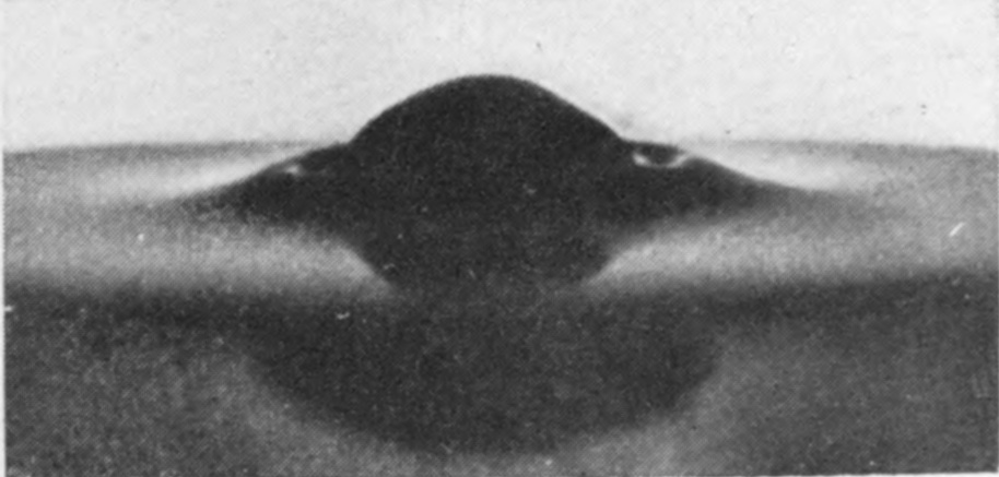 2 0·001 sec. — The sphere sinks further, and the glycerine forms a small raised rim round it with no jets at all.