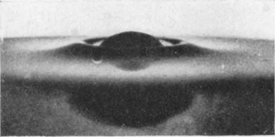 4 0·003 sec. — The sphere is nearly under, the glycerine lies in a broad, uneventful rim round it, and a small blob sits at the left.
