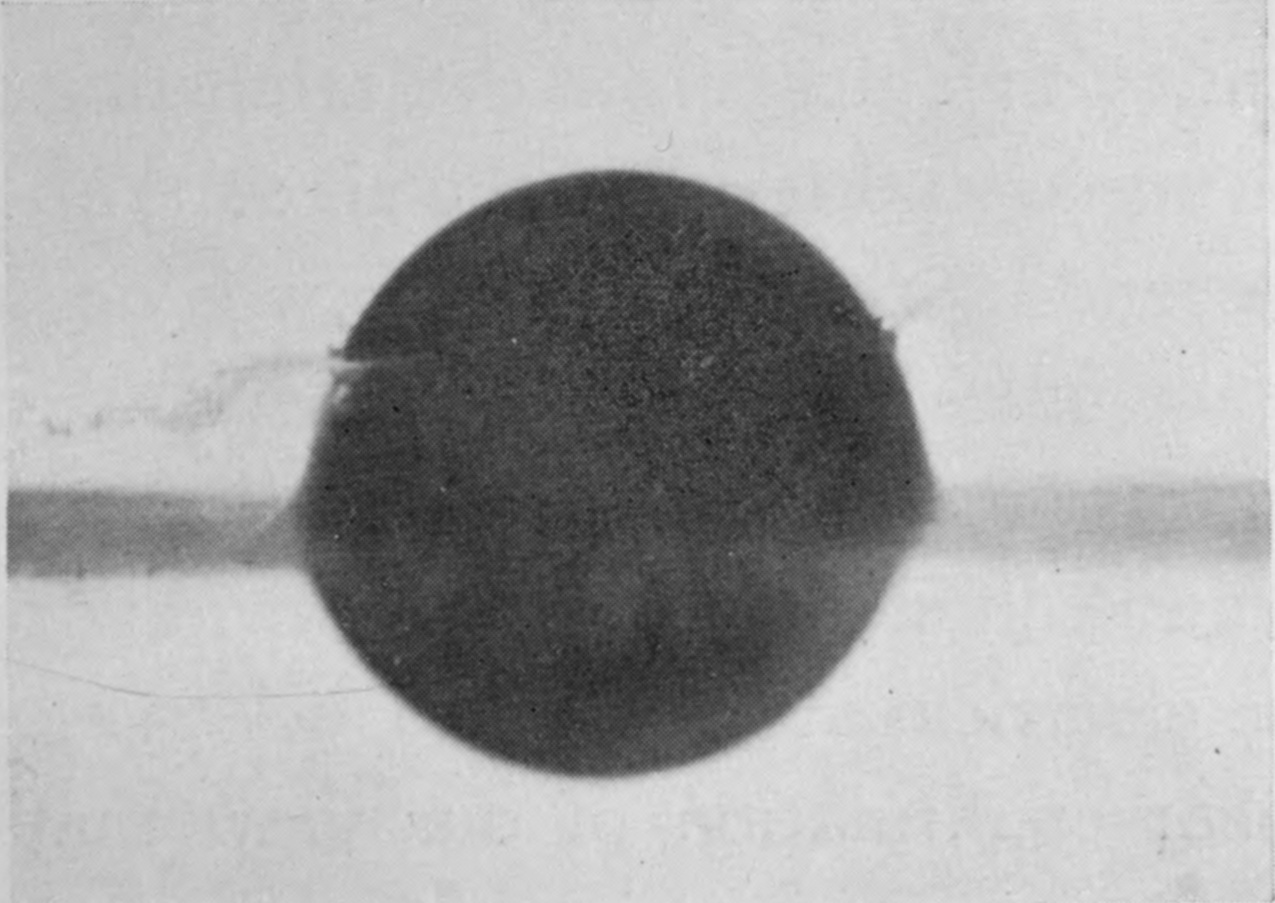 3 — The sphere is only about half submerged; a thin film that left its dusted lower part has, on the left, been brought back against the polished surface higher up.