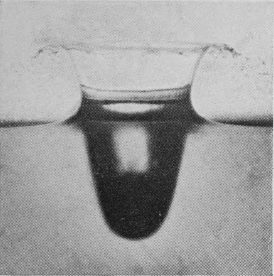 1 0·006 sec. — A broad crater with thin upright walls rises above the surface, and below it a deep, rounded air-cavity follows the sphere down.