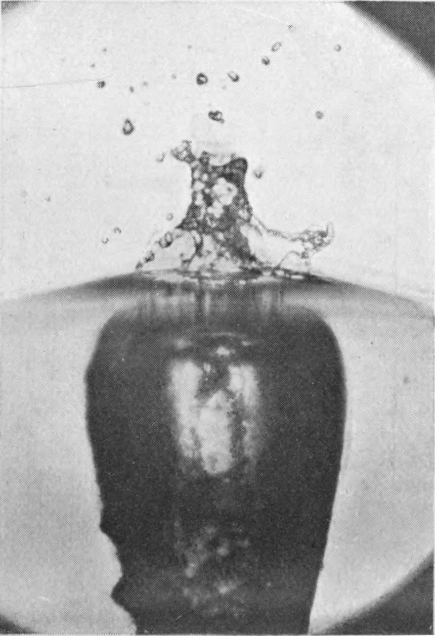 5 0·038 sec. — The dome has collapsed into a turbulent, splashing heap with drops flying off; below, the top of the air-tube is a broad chamber full of confused motion.